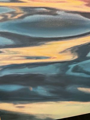 
                  
                    Close up of color waves and and sunset reflections. 
                  
                