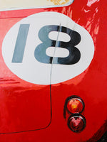 Backend of 1959 Ferrari 250, done in heavily texture red oil paint with racing number 18 in white circle. 